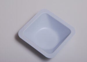 Shows a disposable weighing boat/tray.