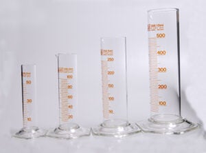 Shows various sizes of graduated cylinders.