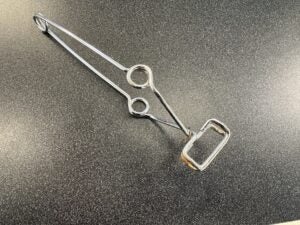 Shows a test tube clamp.