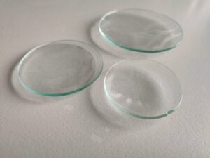 Shows various sizes of watch glasses.