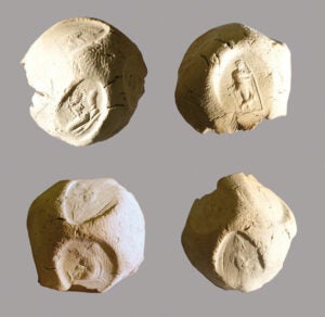 Four views of a bulla with multiple seal impressions.